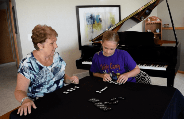 Sally and Student playing Triple Threat Tiles Music Terms and Symbols Game in a Piano Lesson