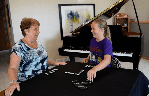 Sally and student playing Triple Threat Tiles Terms and Symbols Music Theory Game