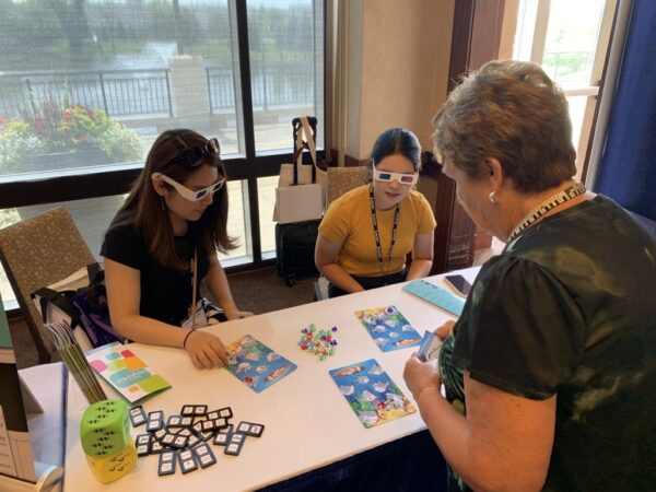 Teachers playing Symbol Shark Music Game at NCKP Conference, Chicago