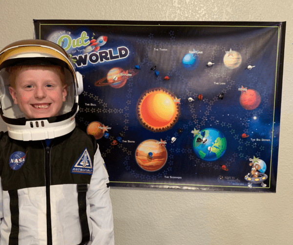 Student in Astronaut Costume and Music is Out of This World Practice Incentive Game Board